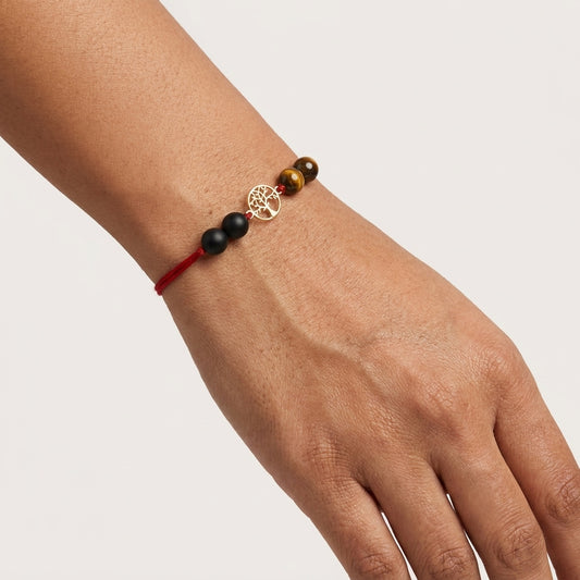 Gold Tree of Life Rakhi with Tiger's eye and black beads.