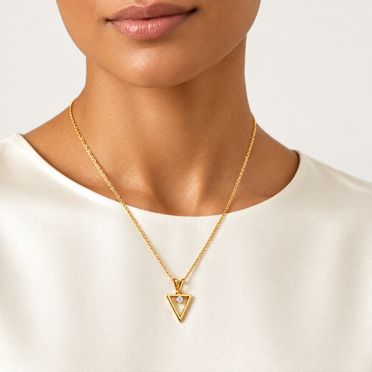 Gold inverted triangle pendant set with a sparkling diamond accent priced under Rs. 15,000