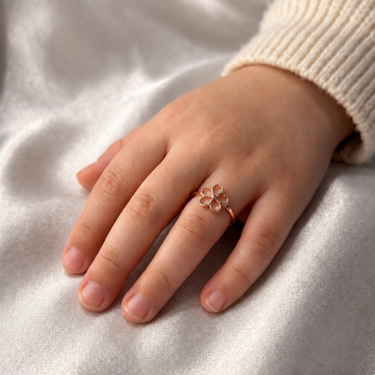 Rose gold open-outline flower ring with five petal loops. Minimal and cute gifts under Rs. 20,000