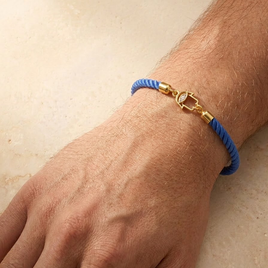 Blue rope men's diamond bracelet with an 18kt gold Hamsa hand charm and diamond accents. Gift for him under Rs. 15,000