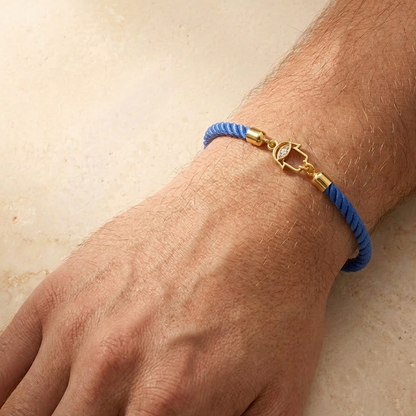 Blue rope men's diamond bracelet with an 18kt gold Hamsa hand charm and diamond accents. Gift for him under Rs. 15,000