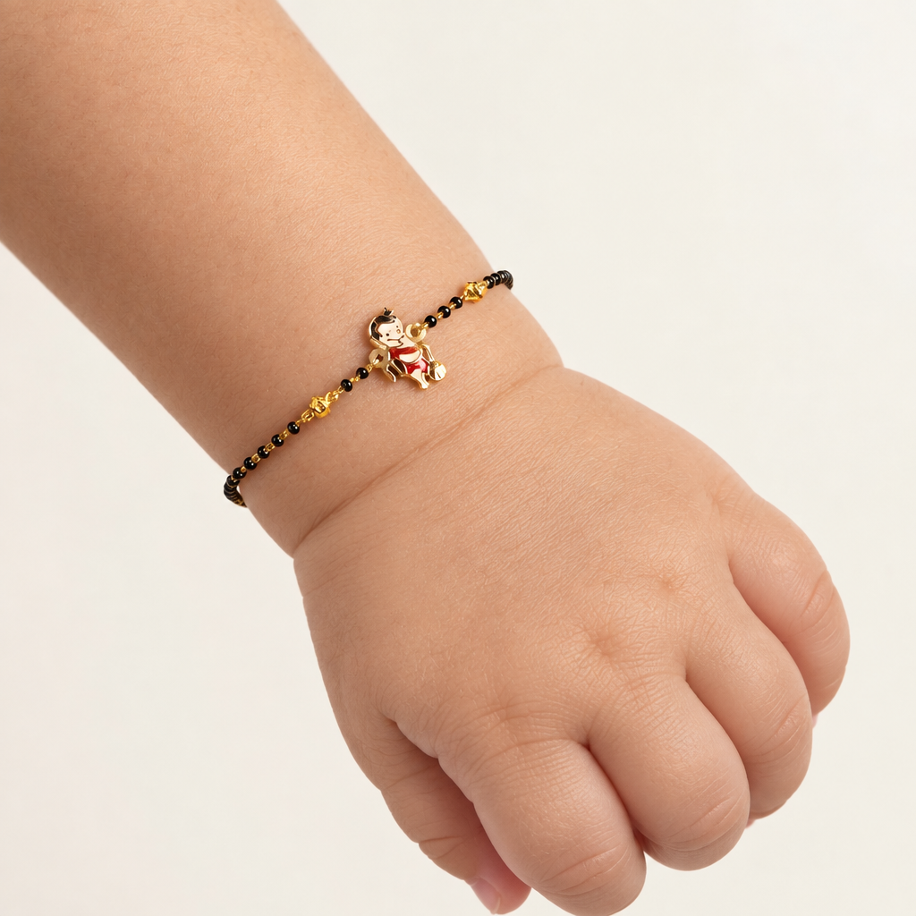 Black bead bracelet with a gold Hanuman charm at the center priced under Rs. 35,000