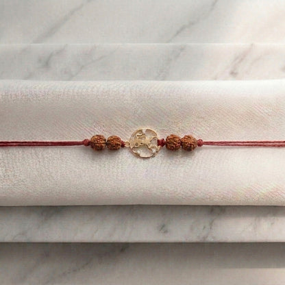 Gold Hanuman Ji Rakhi with sacred Rudraksha beads.