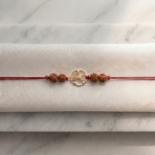 Gold Hanuman Ji Rakhi with sacred Rudraksha beads.