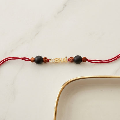 Gold #Bhai Diamond Rakhi with black and Rudraksha beads.