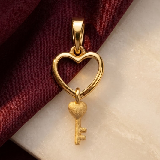 Gold open-heart pendant with a small key charm nestled inside. Minimal and cute gifts for her under Rs. 20,000