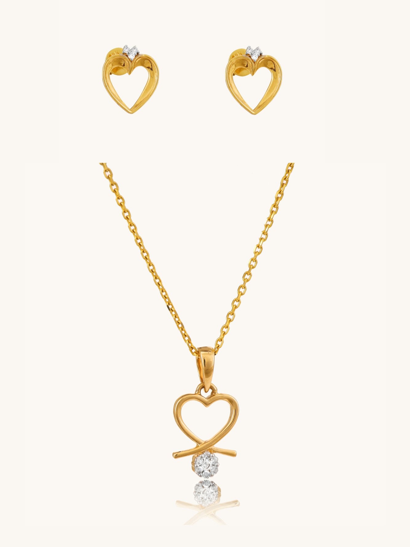 18kt Gold Jewelry Set with Delicate Lining Heart Diamond Earrings & Matching Love Heart Pendant. Elevate everyday style, perfect for workwear or a gift, nder ₹50,000.