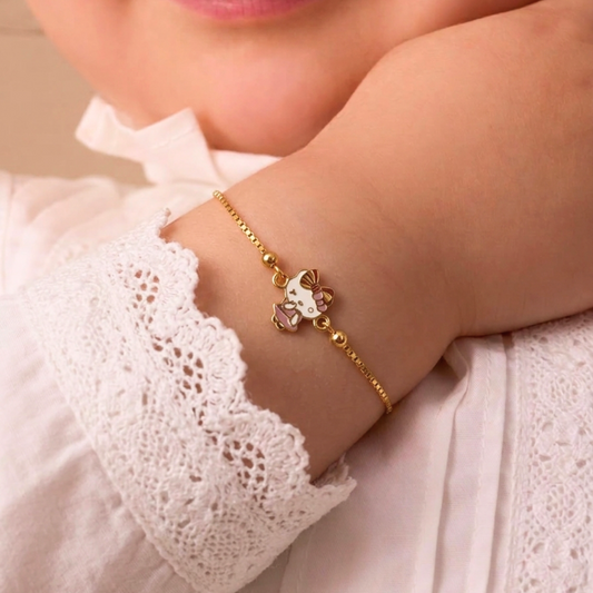 Gold link bracelet featuring a pink and white Hello Kitty charm. A minimal gold gift for kids under Rs. 40,000