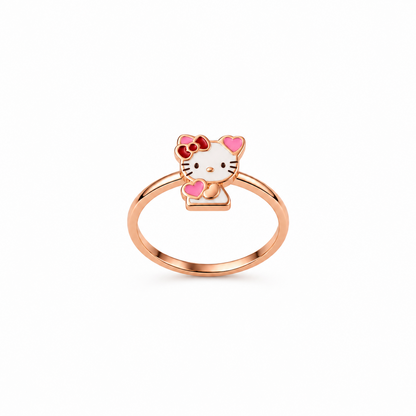 Rose gold ring with a white and pink enamel Hello Kitty charm and red bow. Cute and minimal gifts under Rs. 20,000
