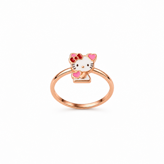 Rose gold ring with a white and pink enamel Hello Kitty charm and red bow. Cute and minimal gifts under Rs. 20,000