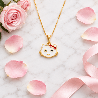 Gold kitty face pendant with a white enamel head and red bow accents under Rs. 20,000