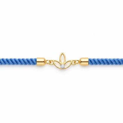 Blue rope men's bracelet with an 18kt gold leaf charm and sparkling diamond accent. A perfect minimal gift for him under Rs. 15,000
