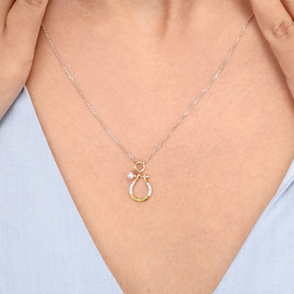 Caratly 18kt gold Horse shoe Pendant featuring a small lucky horseshoe motif with pave diamonds and a single pearl accent. Perfect gift for her under Rs. 20,000