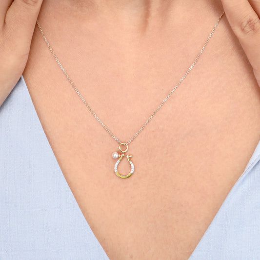 Caratly 18kt gold Horse shoe Pendant featuring a small lucky horseshoe motif with pave diamonds and a single pearl accent. Perfect gift for her under Rs. 20,000