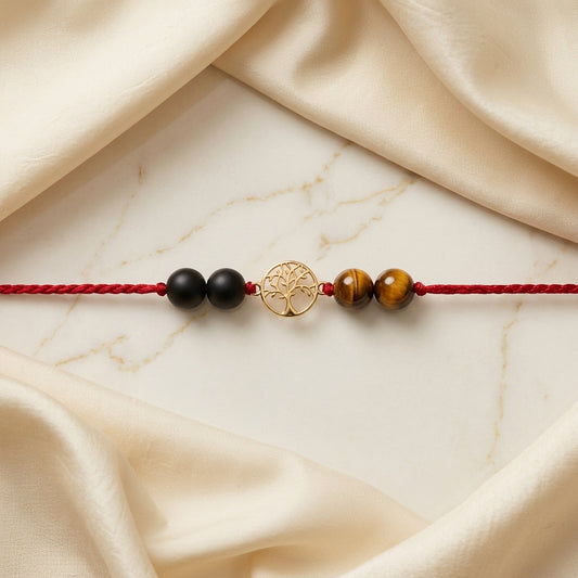 Gold Tree of Life Rakhi with Tiger's eye and black beads.