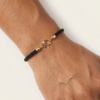 Black rope men's bracelet with an 18kt gold elephant charm and a diamond accent. A gold gift for him under Rs. 15,000