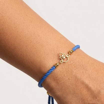 Blue rope men's diamond bracelet with an 18kt gold Kalash-shaped floral charm under Rs. 15,000