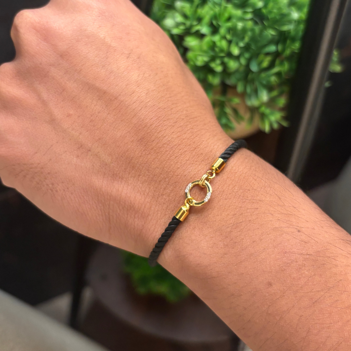 Black rope men's diamond bracelet with an 18kt gold circle charm accented by sparkling diamonds Perfect gift for him under Rs. 20,000
