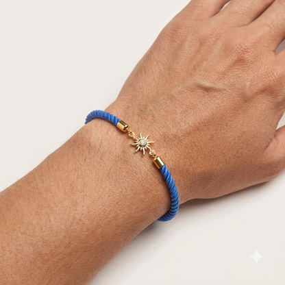 Blue rope men's diamond bracelet with an 18kt gold sunburst charm and diamond center. A minimal gift for him under Rs. 15,000