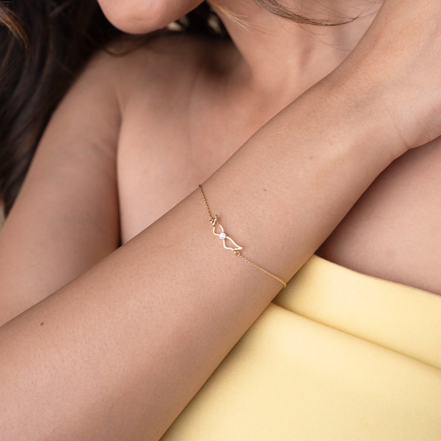 18kt gold Winged Diamond Bracelet with diamond. Accessible price range under Rs. 20,000
