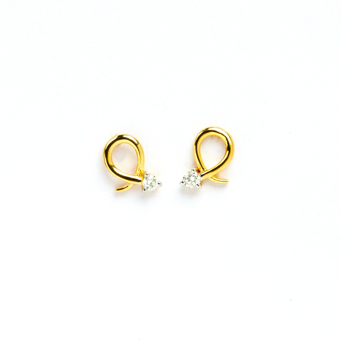 Caratly 18kt gold Loop Diamond Earring with 0.06ct diamond accent in a twisted gold wire loop design, minimal luxury gifts under Rs. 30,000