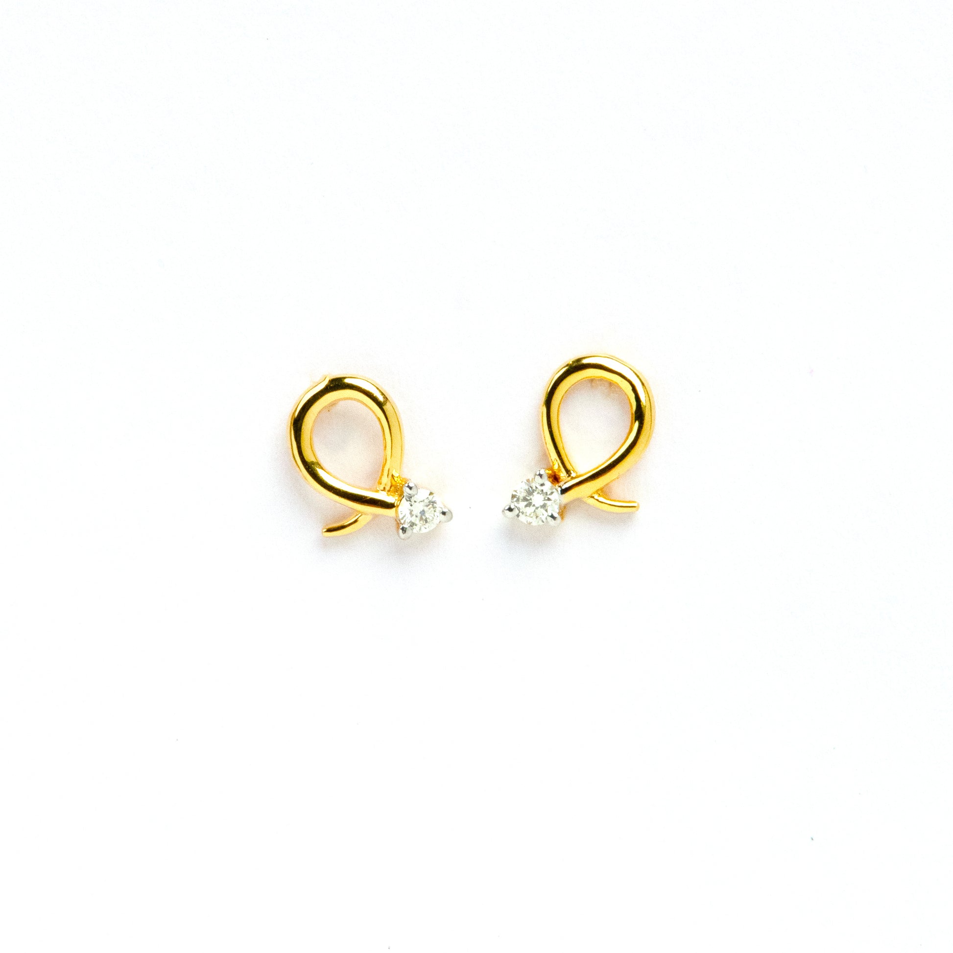 Caratly 18kt gold Loop Diamond Earring with 0.06ct diamond accent in a twisted gold wire loop design, minimal luxury gifts under Rs. 30,000