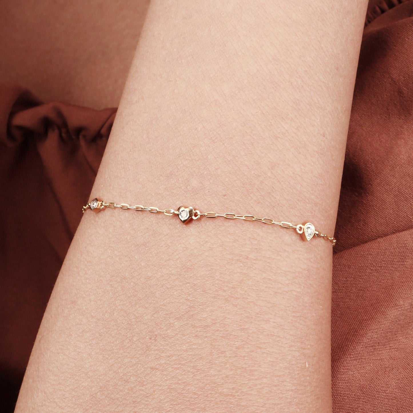Caratly 18kt gold 4 Style Diamond Bracelet featuring a delicate chain with spaced diamond stations in various shapes including a heart and hexagon under Rs. 30,000