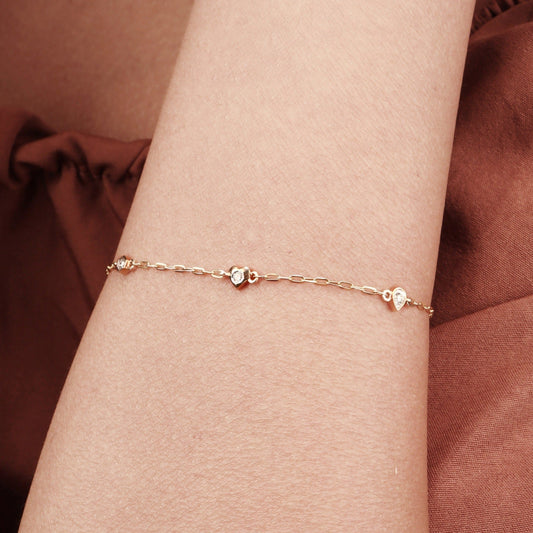 Caratly 18kt gold 4 Style Diamond Bracelet featuring a delicate chain with spaced diamond stations in various shapes including a heart and hexagon under Rs. 30,000