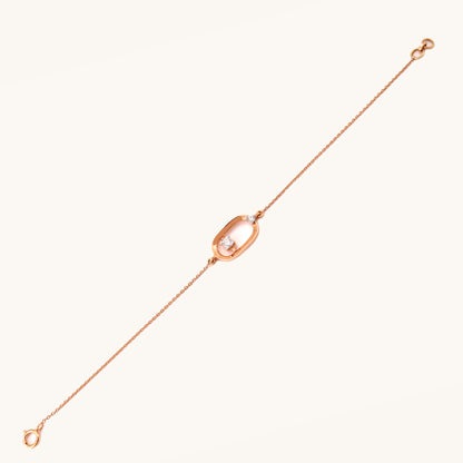 Caratly 18kt gold Encircle Diamond Bracelet featuring an elongated open oval link with a single floating diamond in the center and side accents. Best everyday jewellery gift for her under Rs. 45,000