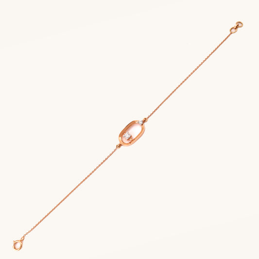 Caratly 18kt gold Encircle Diamond Bracelet featuring an elongated open oval link with a single floating diamond in the center and side accents. Best everyday jewellery gift for her under Rs. 45,000
