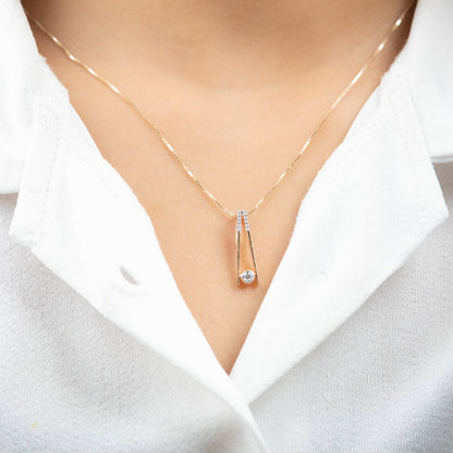 Caratly 18kt gold Elegant Diamond Pendant with 0.10ct solitaire diamond in a modern V-shape drop setting. Minimalist gift ideas for her under 40,000