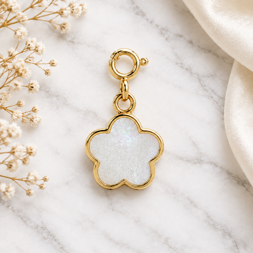 Gold flower-shaped pendant with a white mother-of-pearl inlay. Cute minimal gifts under Rs. 15,000