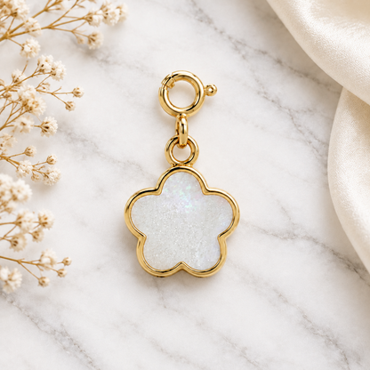 Gold flower-shaped pendant with a white mother-of-pearl inlay. Cute minimal gifts under Rs. 15,000