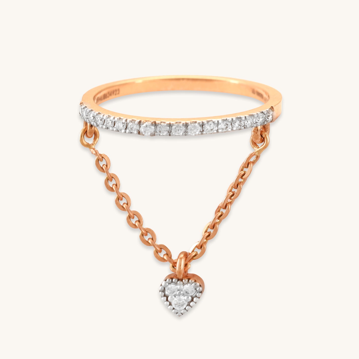 Caratly 18kt gold Dangling Diamond Ring featuring a straight pave diamond band with an attached draped chain holding a tiny diamond heart charm under Rs. 50,000