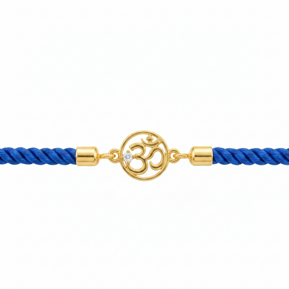 Blue rope men's bracelet with 18kt gold Om charm and diamond accent, laid flat on a white background. An affordable gift for him under Rs. 15,000