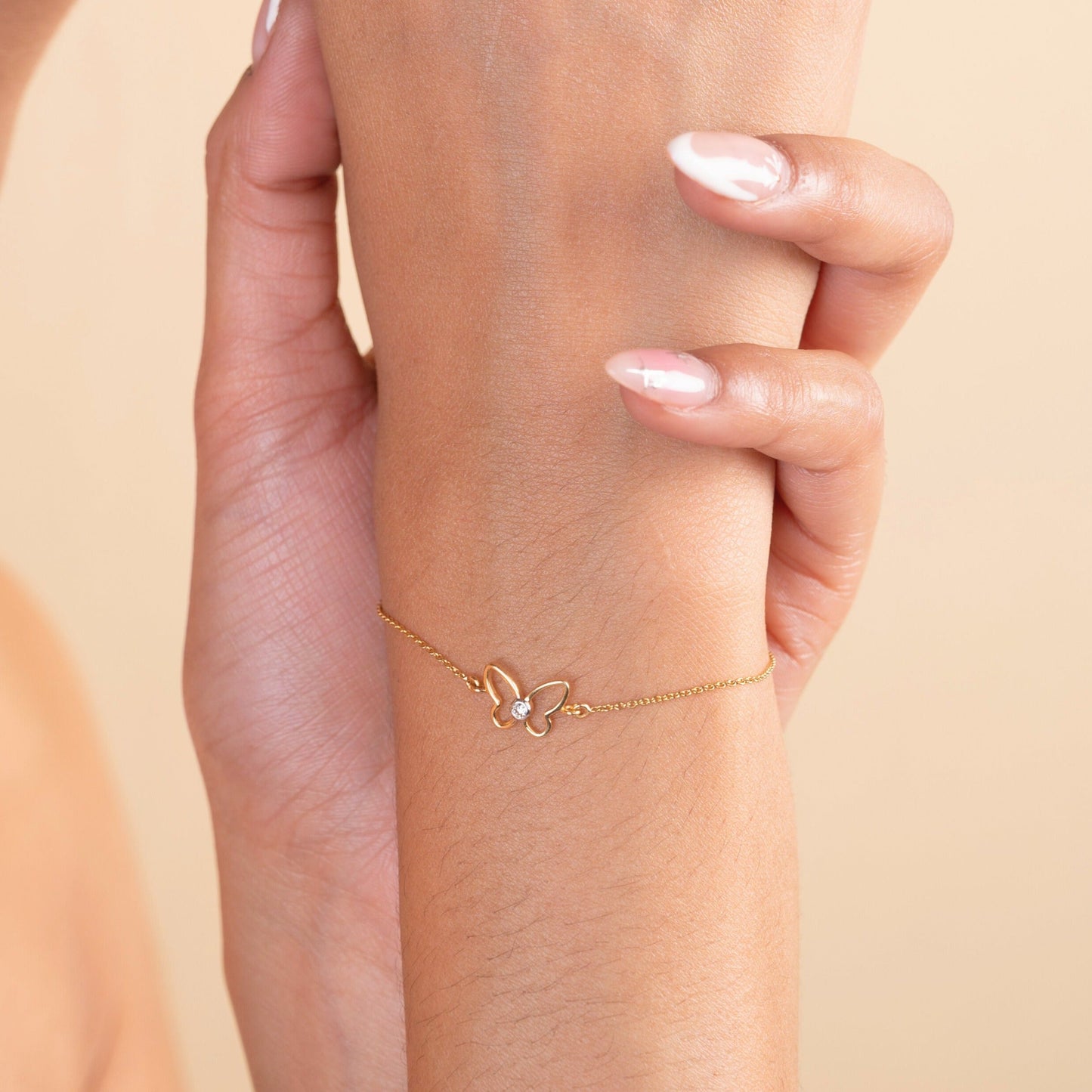 18kt gold Elsa Butterfly Bracelet with diamond. Mid-tier price range under Rs. 20,000