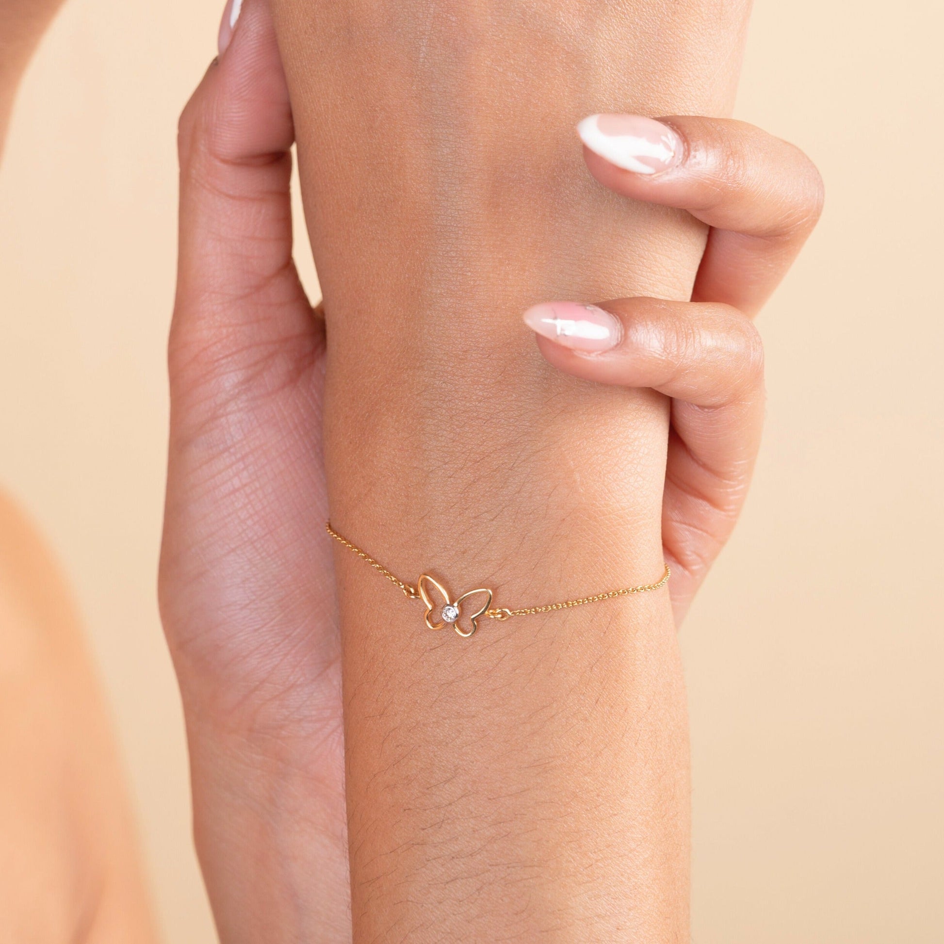 18kt gold Elsa Butterfly Bracelet with diamond. Mid-tier price range under Rs. 20,000