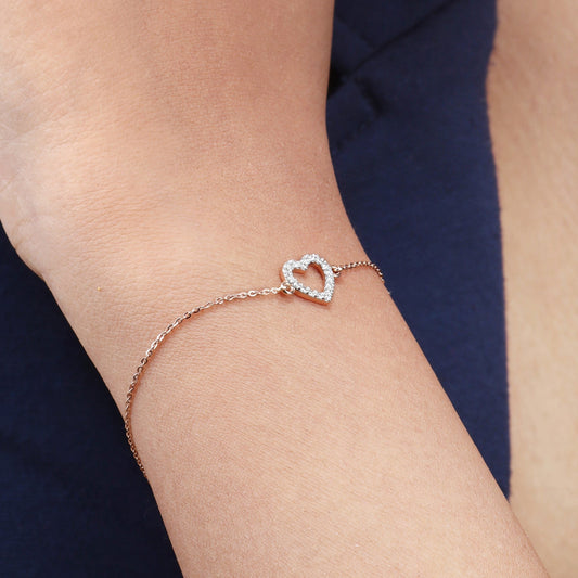 Caratly 18kt gold Heart Diamond Bracelet with 0.13ct diamond pave open heart outline charm on a delicate chain under Rs. 40,000