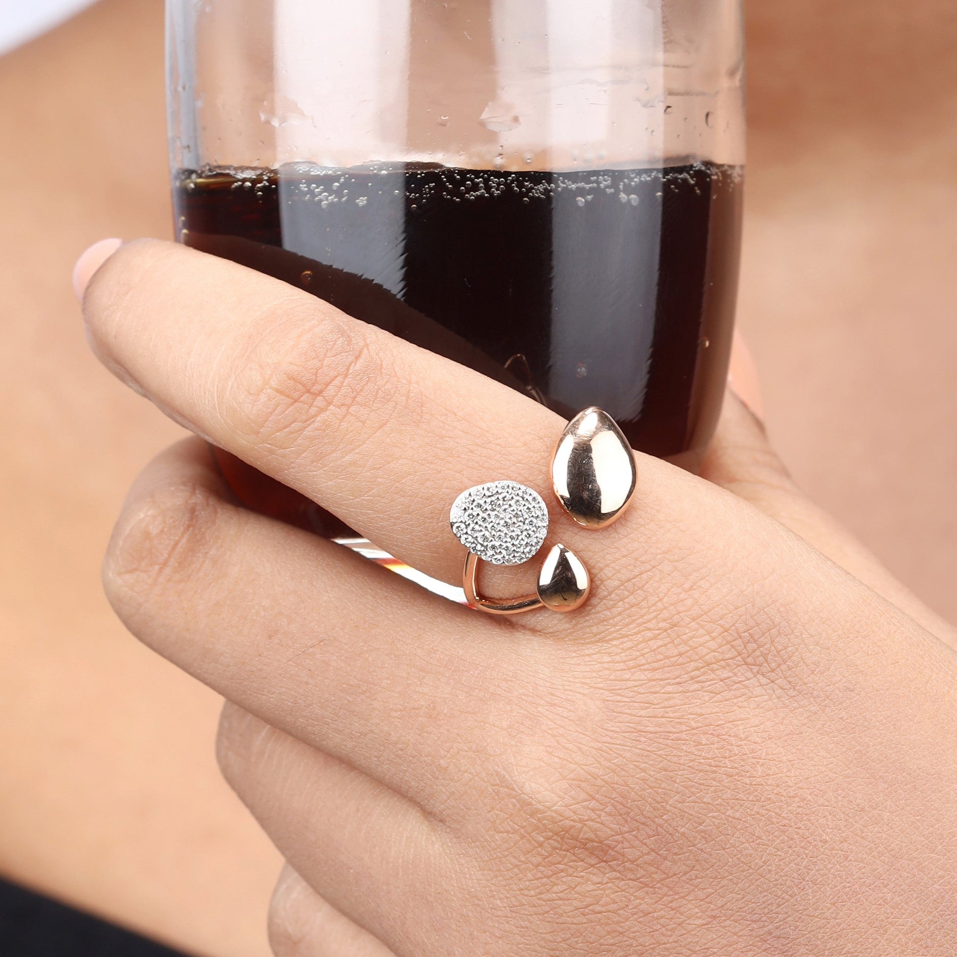 Caratly 18kt gold Pebble Diamond Ring featuring an open wrap design with three organic pebble shapes, one set with 0.19ct pave diamonds and two in polished high-shine gold