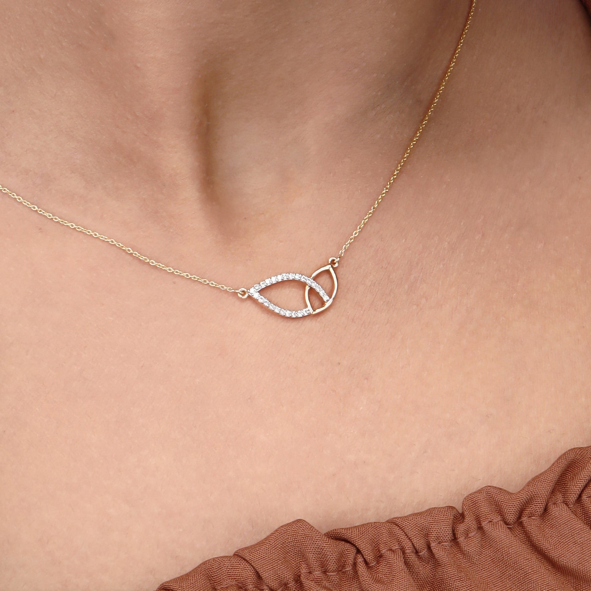 Caratly 18kt gold Leafy Diamond Necklace featuring two sideways overlapping open leaf shapes, one plain gold and one set with diamonds under Rs. 60,000