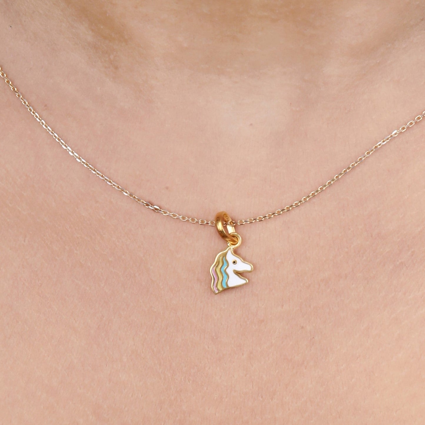 Caratly 22kt gold Unicorn Baby Pendant featuring a small unicorn head charm decorated with pastel enamel stripes under Rs. 20,000