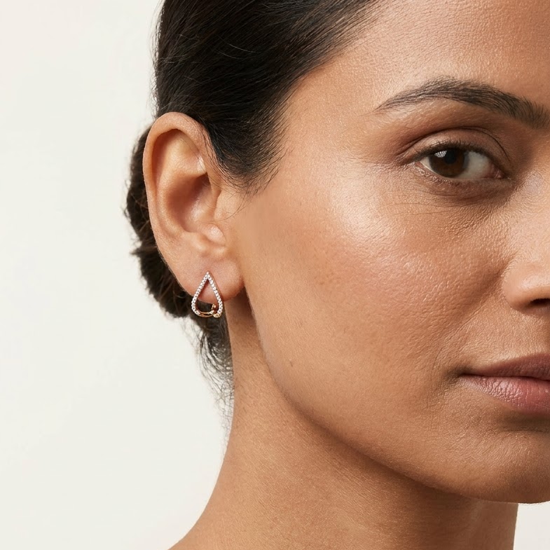 Gold open pear-shaped earrings outlined with pave diamonds. Luxe gift for her under Rs. 80,000