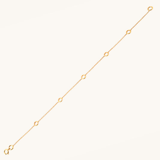 Caratly 18kt gold Charm Bracelet base chain featuring evenly spaced circular rings designed for clipping on personalized charms. Customizable gifts under Rs. 20,000