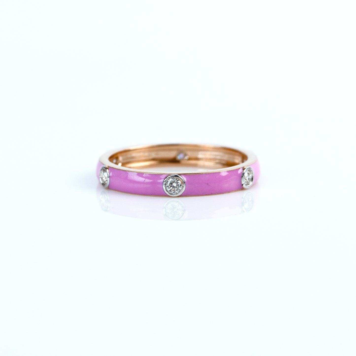 Caratly 18kt gold Pink Band Ring with pink enamel surface and 0.17ct flush set diamond accents under 50,000