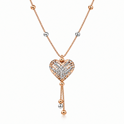 Rose gold heart-shaped pendant with a woven diamond cage design and dangling bead accents. Luxe gifts for her under Rs. 80,000