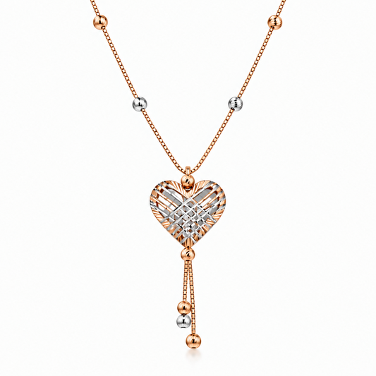 Rose gold heart-shaped pendant with a woven diamond cage design and dangling bead accents. Luxe gifts for her under Rs. 80,000