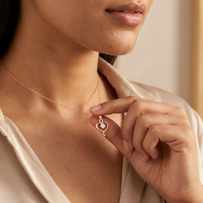 Rose gold open heart pendant set with a large sparkling centre diamond, priced under Rs. 25,000