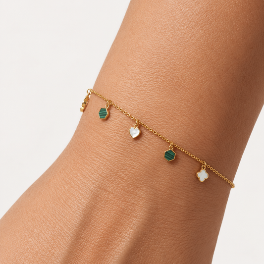 Gold chain bracelet with alternating green and white gemstone drops priced under Rs. 60,000