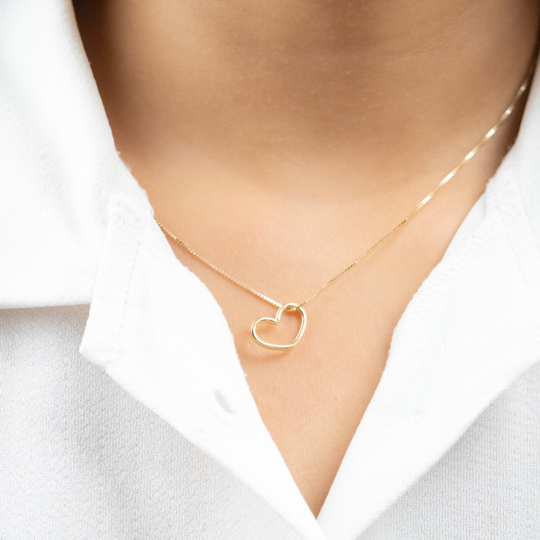 Caratly 18kt gold Minimal Heart Pendant with simple open heart wireframe design under Rs. 15,000