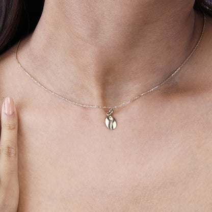 Caratly 18kt gold Coffee Gold Charm featuring a small, polished solid gold coffee bean motif hanging from a delicate chain. A perfect minimal affordable gift for her under Rs. 20,000